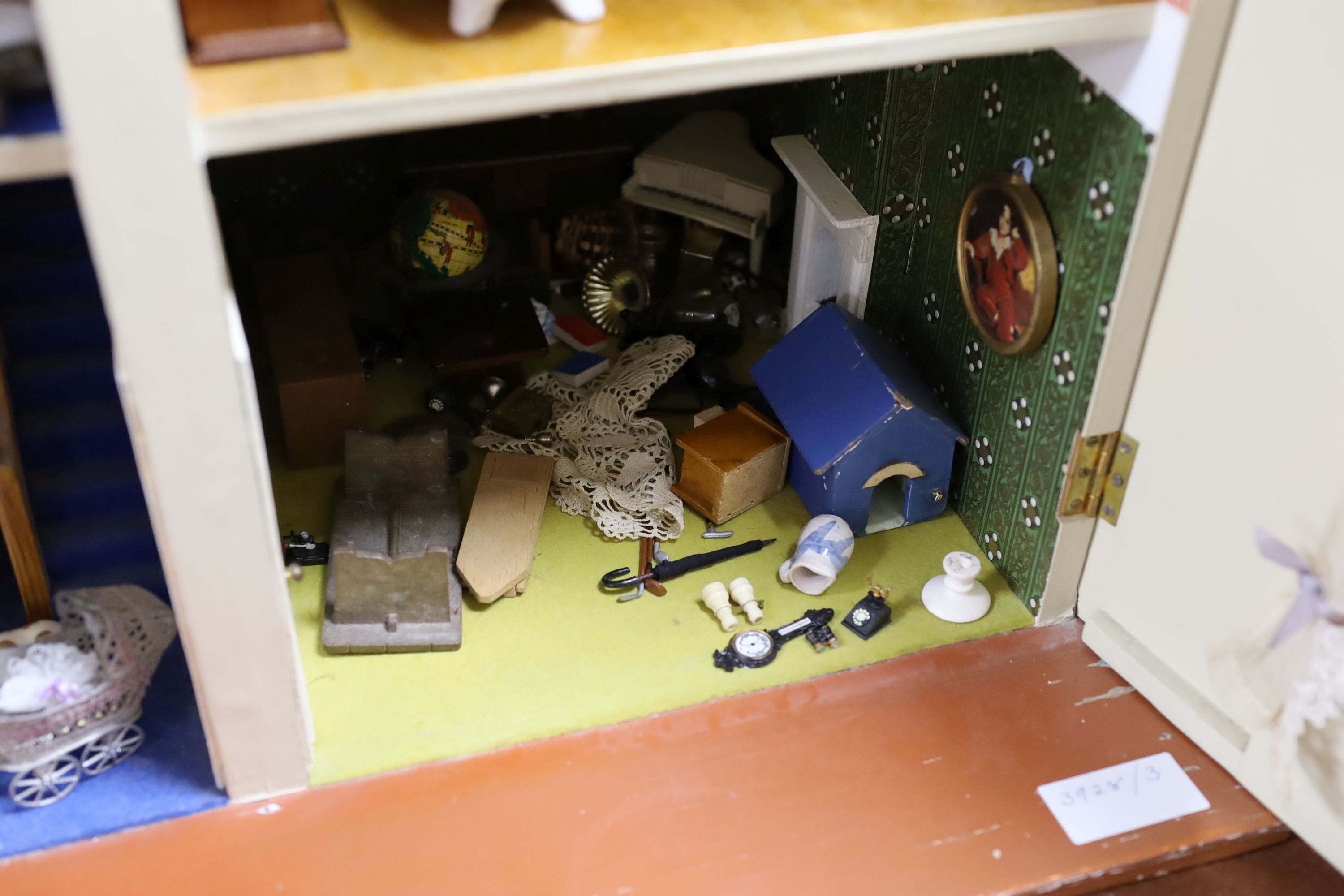 A dolls house, length 74cm, depth 39cm, height 66cm